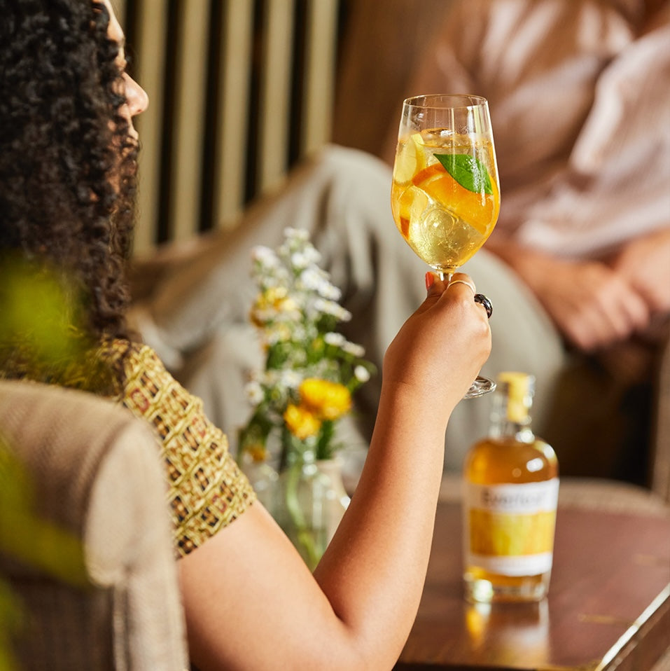 A lady enjoying an Everleaf Forest spritz